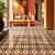 Unity Flora Ceramic Athangudi Tile 12 Inch x 12 Inch featuring an elegant yellow and red Moroccan-inspired Athangudi printed pattern with traditional Rangoli motifs in a matt finish. This premium ceramic tile is designed for both wall and floor applications, making it ideal for bathrooms, kitchens, balconies, bedrooms, living rooms, feature walls, accent spaces, and heritage-inspired interiors