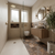 Modern bathroom with shower, sink, and decorative elements and brown patterned floor tiles