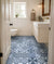 Visby Moroccan Vitrified Tile 16x16 Inch (B) featuring an elegant Moroccan and Rangoli-inspired printed pattern with a matt finish. This vitrified bathroom floor tile offers excellent durability, moisture resistance, anti-slip properties, and a decorative geometric surface, making it suitable for modern and traditional residential bathroom flooring, powder rooms, wash areas, and other indoor spaces requiring long-lasting performance and easy maintenance.