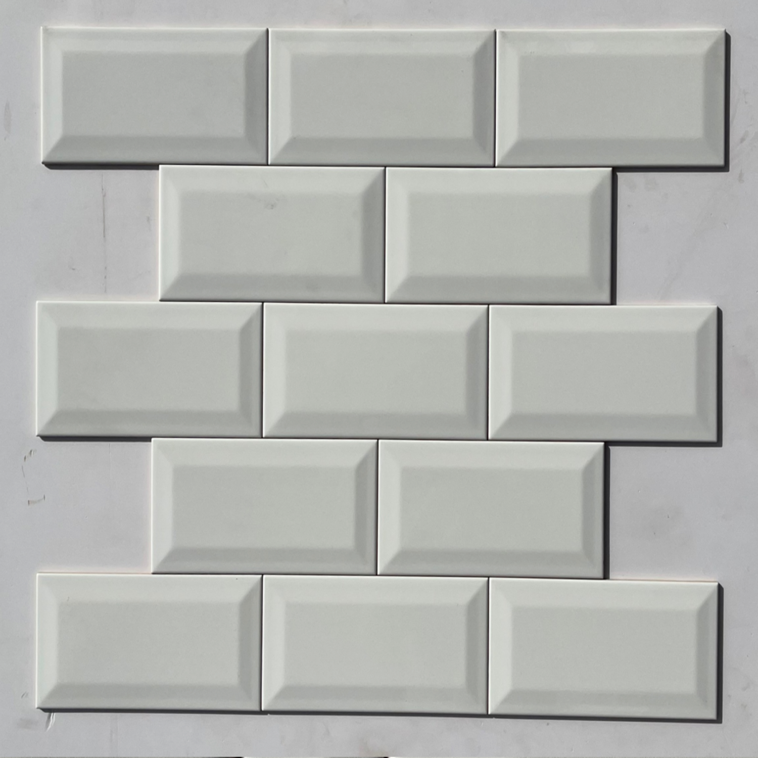 White Bevelled Subway Tile 4 x 8 inch featuring a classic white design with beveled edges, perfect for adding a timeless and elegant touch to walls and surfaces.

