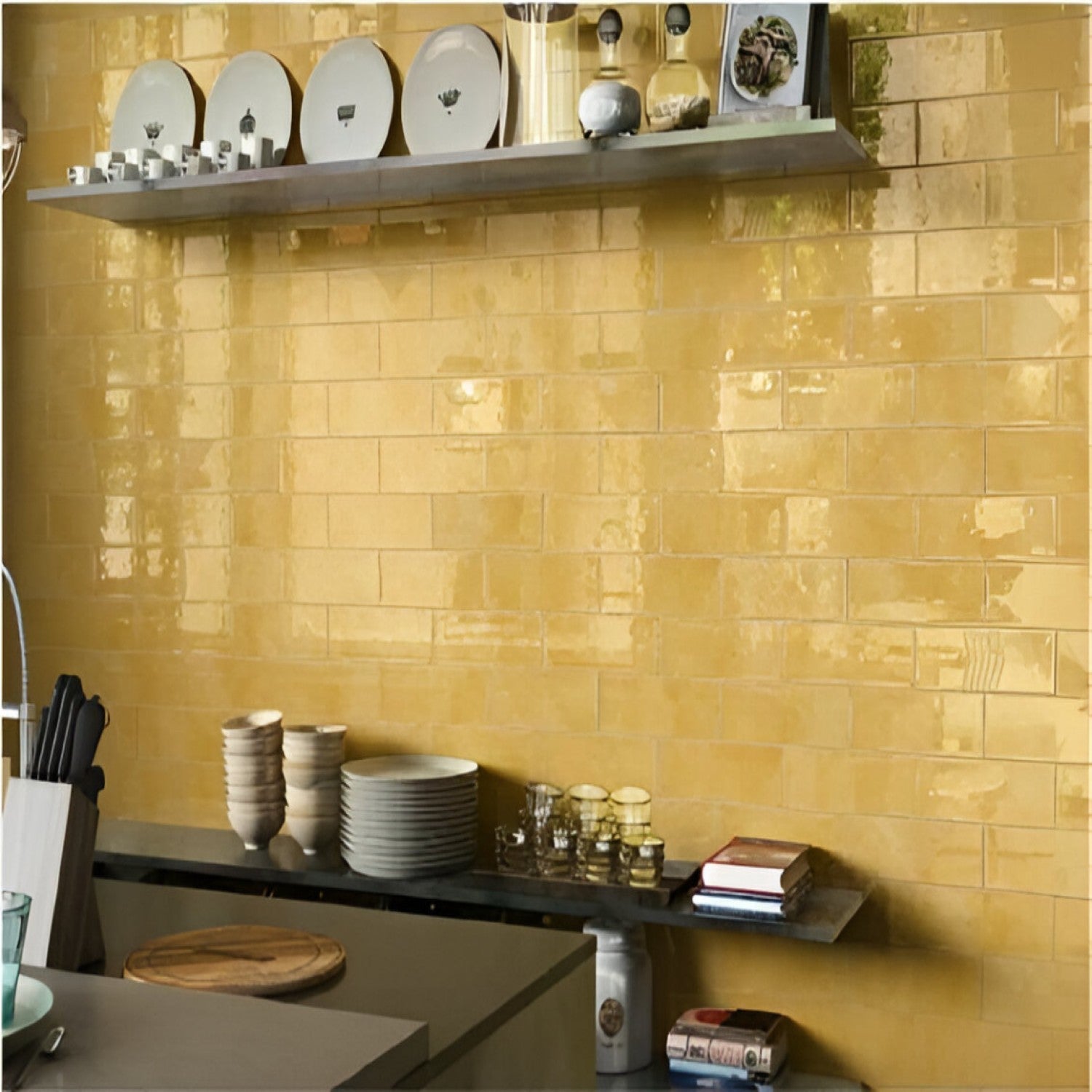 A kitchen wall featuring York Yellow 4 inch * 12 inch subway tiles with a glossy finish, complemented by a shelf with plates and kitchen accessories.