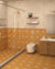 Blossom Yellow Athangudi tile on bathroom floor and walls up to 4 ft with Urbantek Beige above